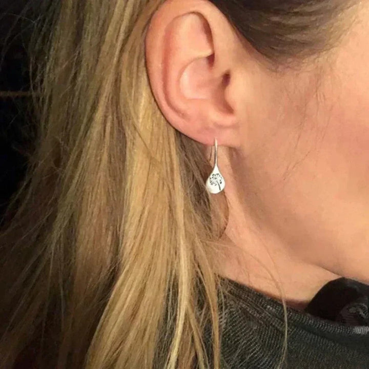 Élégantes boucles d'oreilles design feuille de pissenlit