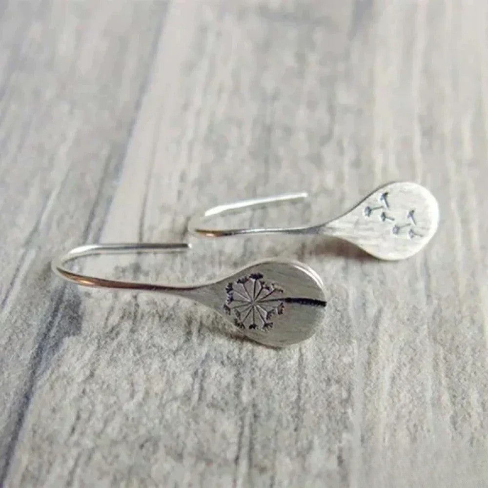 Élégantes boucles d'oreilles design feuille de pissenlit