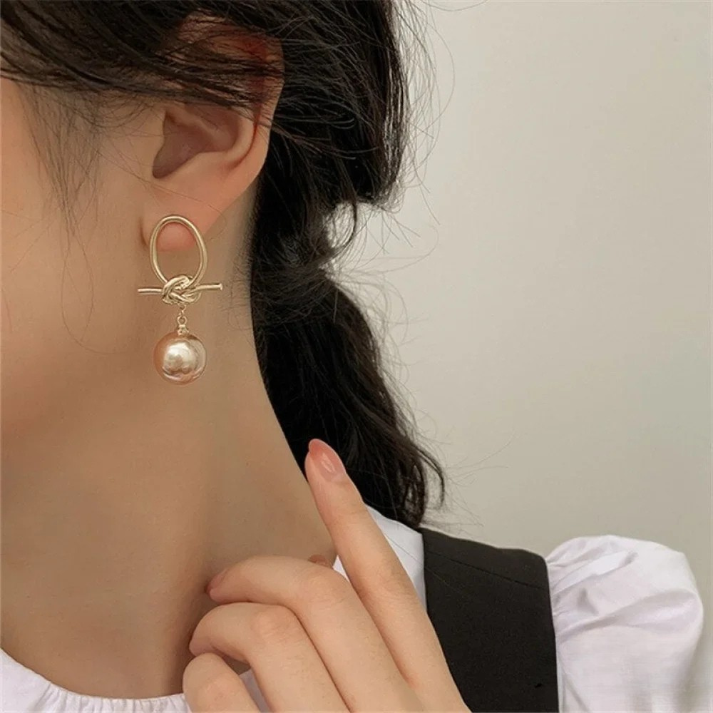 Boucles d’oreilles créoles dorées à perles