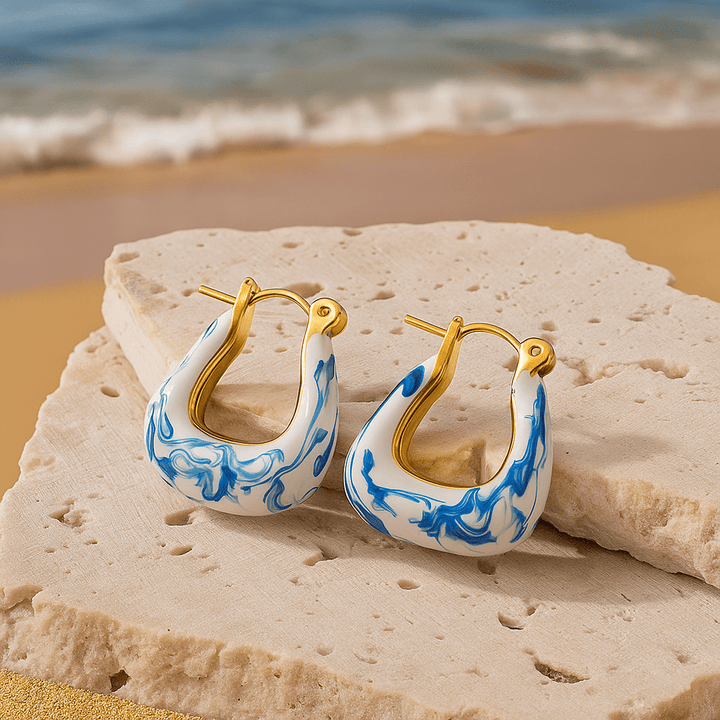 Boucles d'oreilles plume dorées