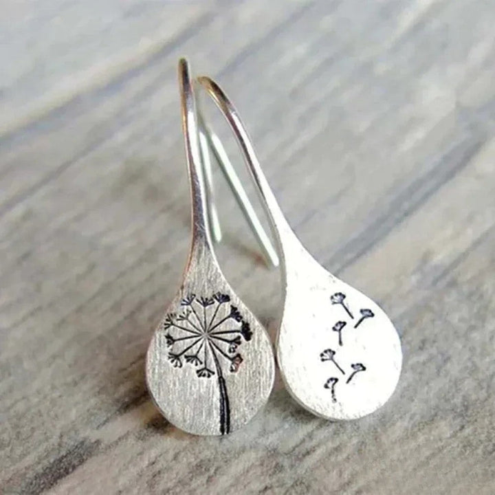 Élégantes boucles d'oreilles design feuille de pissenlit